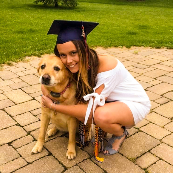 Gradutate with her dog