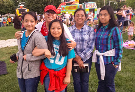 Another picture of the picnic with a student of Notes of Joy Music